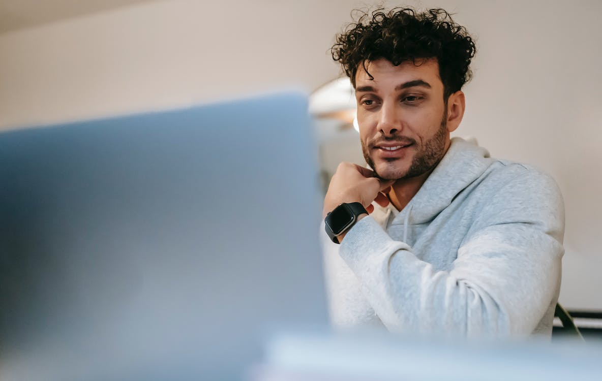 A man wearing an Apple watch and downloading Chrome extensions