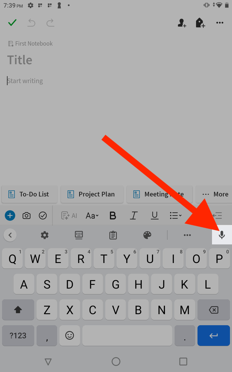 A red arrow pointing to the Voice Typing key