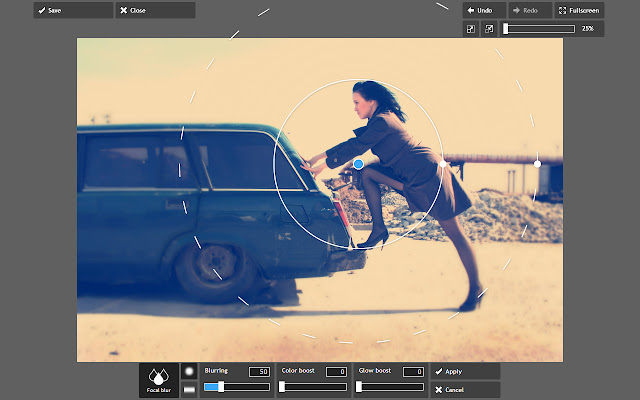 A user editing an image of a woman leaning against a station wagon