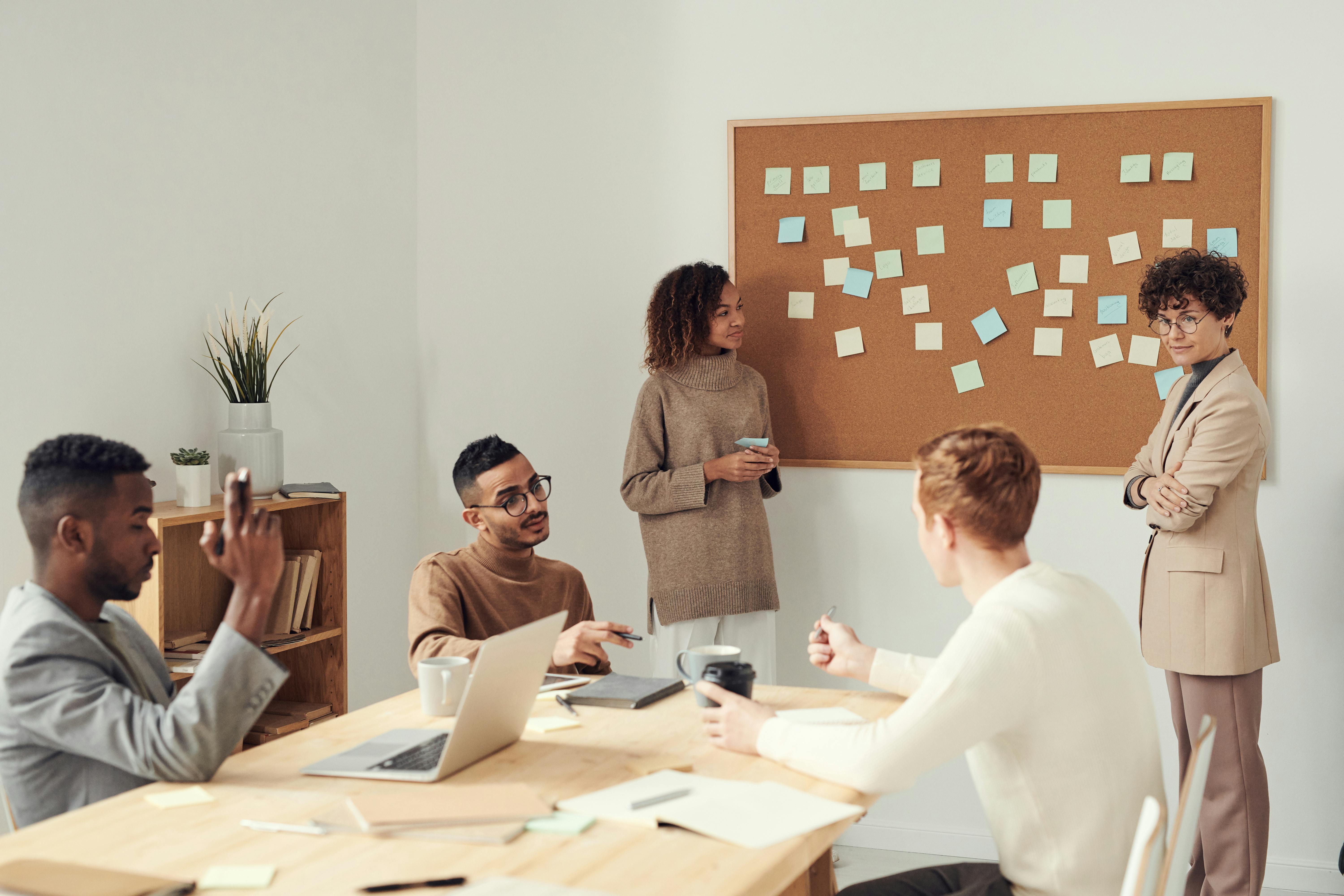 Professional boardroom with executives taking notes during a formal board meeting