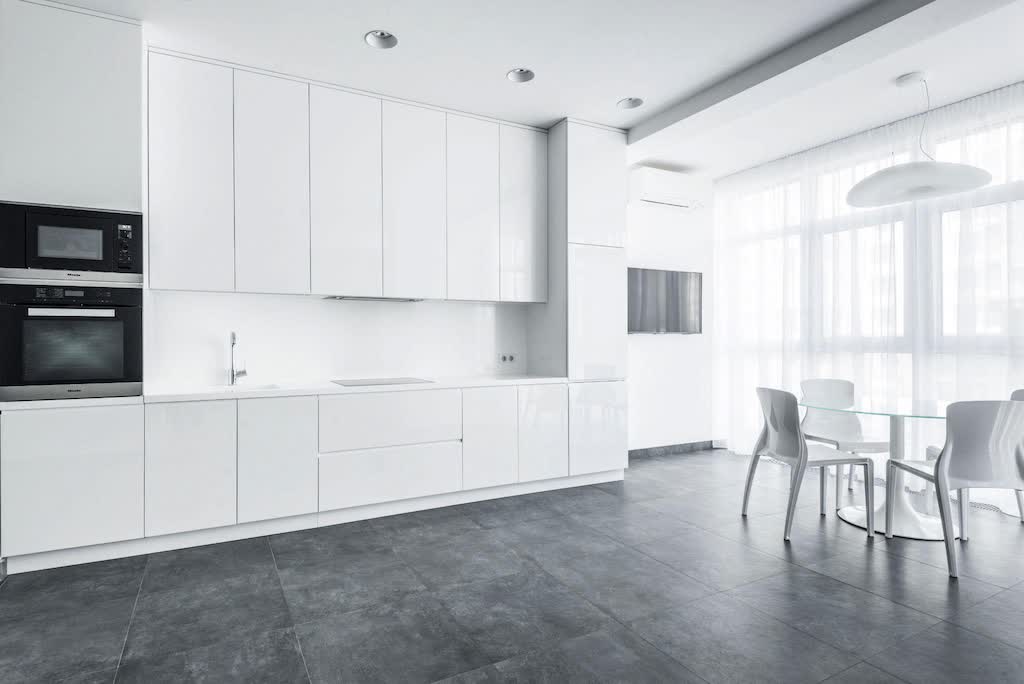 White Dining Chairs and Table Near White Cabinets